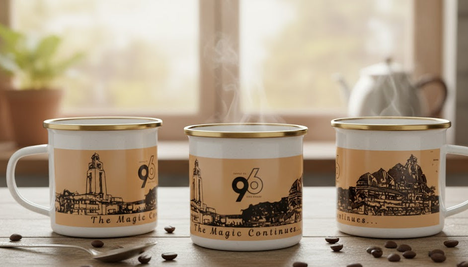 Three mugs with scenic designs and numbers on a wooden table with coffee beans.
